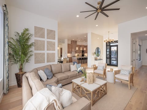 This light and open living room provides lots of seating and is conveniently located adjacent to the Kitchen and Dining Table.