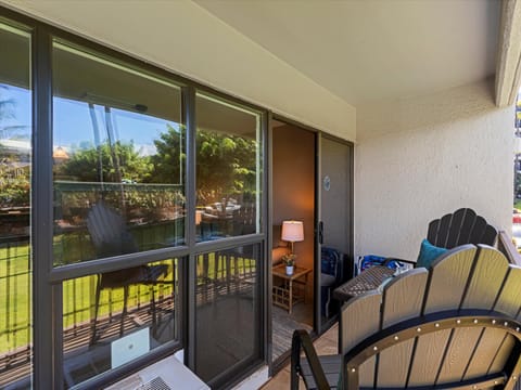 Enjoy lazy afternoons on your private balcony, where tropical views and cool breezes meet comfortable seating—perfect for morning coffee or evening relaxation.