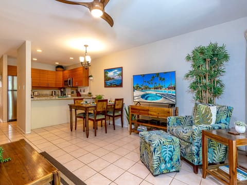 Open concept living~ dining & kitchen areas w/ tropical decor.