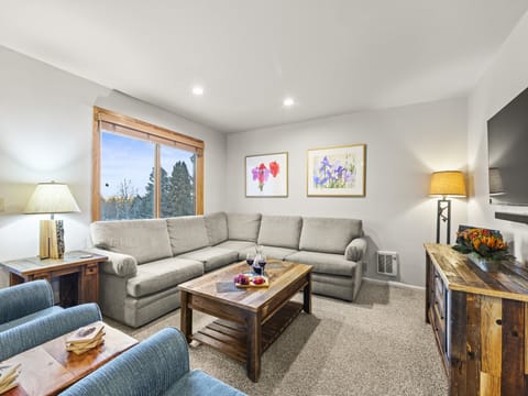 Snowflower 41 offers a spacious living area with a large sectional sofa.