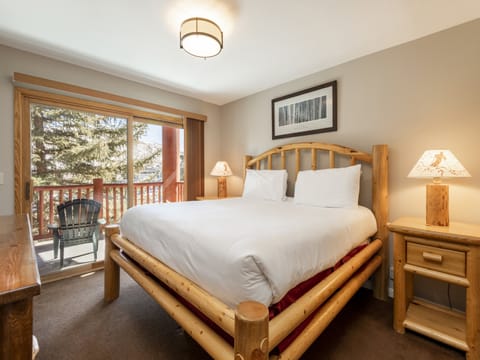 Log bedframe in the main bedroom