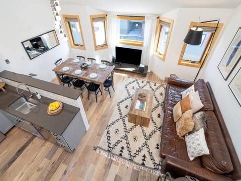 Recline on the decadent, oversized leather sofa or lounge in the giant faux-fur Lovesac bean bag