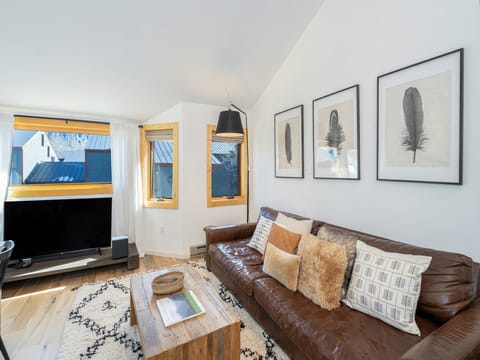 The living room enjoys uninterrupted views of Ajax peak from the living room window.