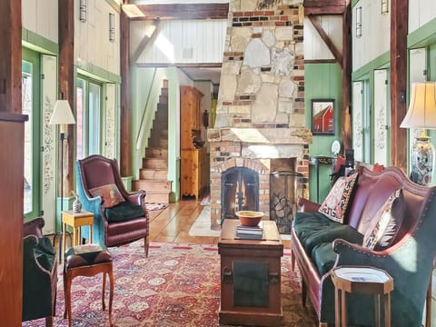 Living room with a wood burning fireplace.