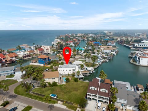 Aerial view of the property and channel leading to the Laguna Madre Bay