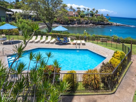 Pool on property with an ocean view