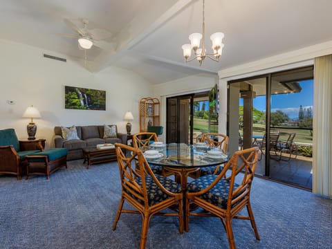 Bright and spacious living room with golf course views.