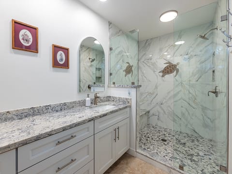 Newly renovated primary bath with dual sinks.