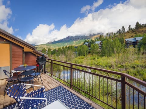 imagine how perfect Sitting out on this deck is on a warm summer night with the views of the mountains and the sound of the pond in front.