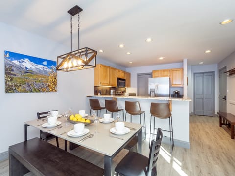 Spacious open kitchen concept with bar seating and dining area for family and friends.