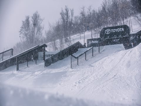 A snow-covered terrain park