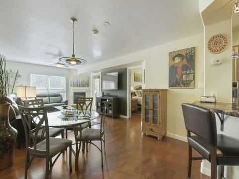 Gather around your dining table in this open-concept space that flows effortlessly from living room to kitchen. Natural light and warm hardwood floors make mealtimes feel relaxed and social.