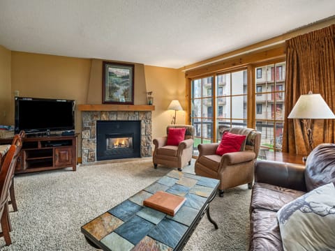 Northstar 114 - a SkyRun Steamboat Property - Welcome to Northstar 114! - Couch, fireplace, sliding glass door.