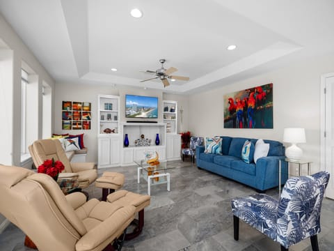 2nd Floor spacious living area surrounding a Flat Screen TV
