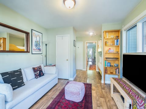 Third floor condo features private balcony, king bed, bunks as well as galley kitchen and cozy living space.