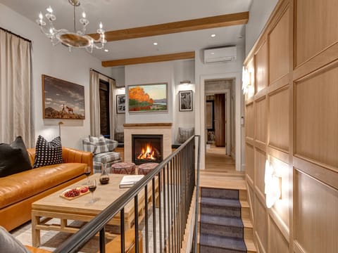 Blue Church Lodge G offers a luxuriously stylish living room with a flat screen TV and gas burning fireplace.