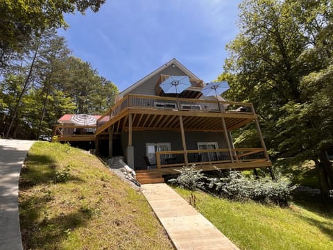 Two levels of outdoor patio space with a balcony for one of the top-level bedrooms.