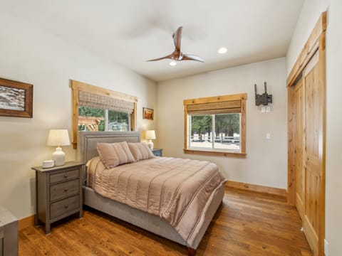 Primary bedroom with queen bed and attached private bathroom