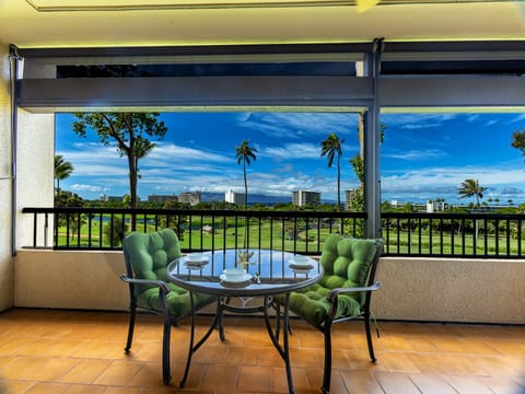 Relax and unwind on the lanai with stunning golf course and ocean views!