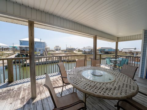 Anchor Eways Covered Balcony Outdoor Dining Space with Canal and Gulf View