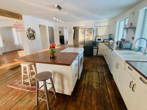 Cook, chat, and connect - spacious kitchen with a large island flows seamlessly into dining area for effortless entertaining