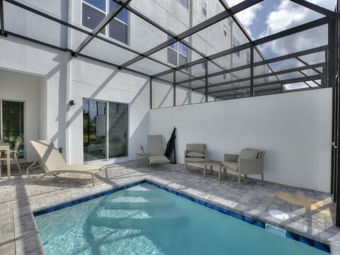 Spacious Pool with Covered Patio Area