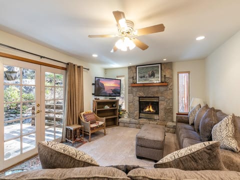Cozy living room with a fireplace, perfect for relaxing after a day of adventure.