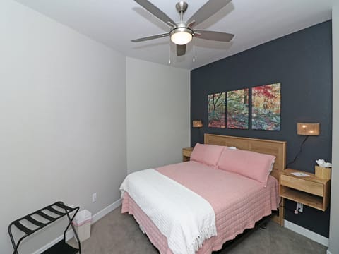 Secondary bedroom with queen bed and private balcony