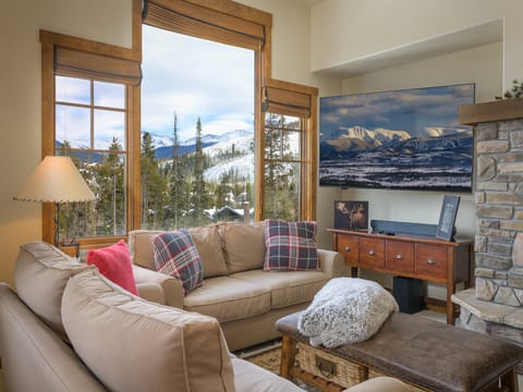 Cozy Living Room with fireplace and panoramic mountain views.