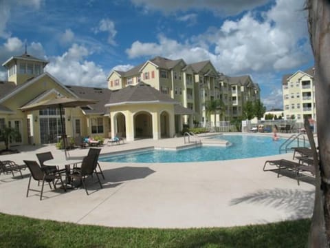 Relax by the sparkling pool with lounge chairs and scenic views of the property.