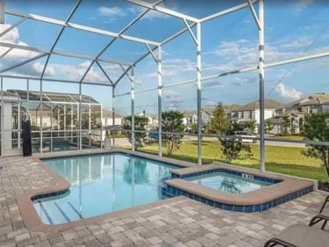 Relax by the private screened-in pool with serene views.
