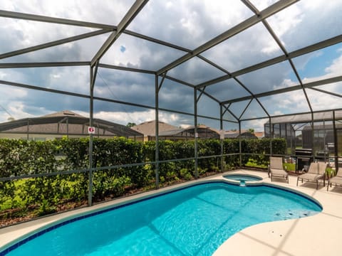Sparkling private pool with screened enclosure, perfect for relaxation and fun.