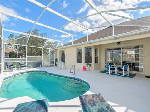 Private screened pool perfect for sunbathing and family fun under the Florida sky.