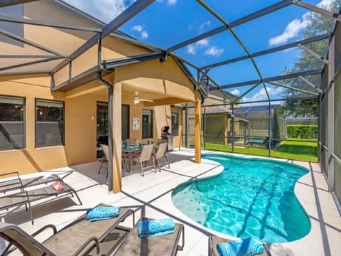 South facing screened in private patio with curved pool, dining set, chaise lounges & bbq!