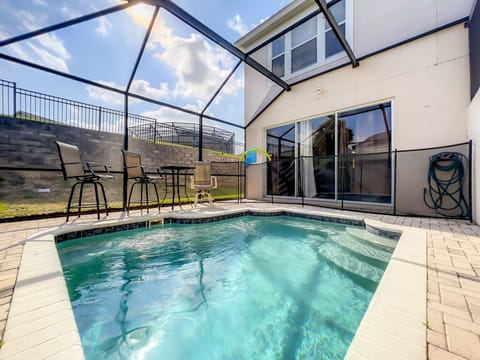 Private screened-in pool with plenty of sunlight and space to relax.