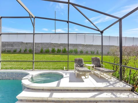 Soak up the sun or unwind in the spa, overlooking a peaceful backyard.