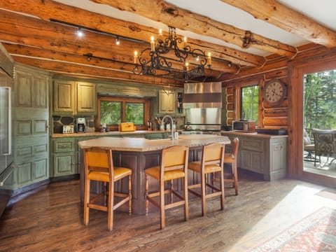 Spacious Kitchen with modern amenities, large kitchen island and bar seating for 4.