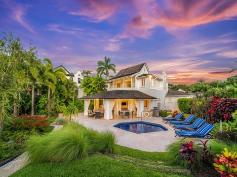 A secluded private pool area within manicured garden
