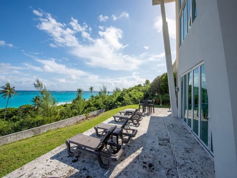 Patio with 180-degree beach and ocean views spread out in front of you.