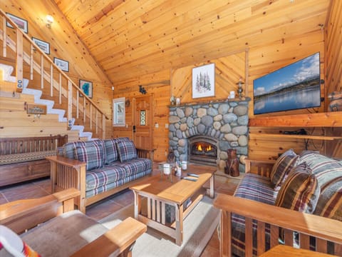 Plenty of seating in the main living room, perfect for gatherings around the cozy river-rock gas fireplace and watching your favorite shows on the flat screen TV.