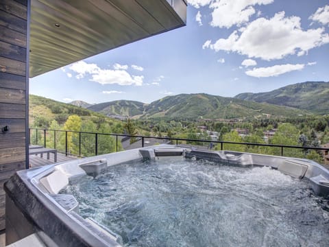 The private hot tub on the deck with views of Deer Valley Resort and Park City Mountain Resort