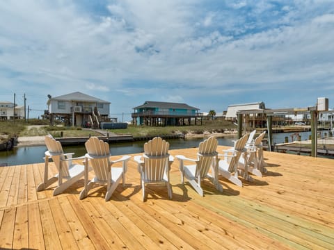 Coastal Château Canalfront Deck with Adirondack Chairs Wide View