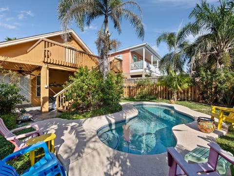 Relax in your sunny private pool surrounded by swaying palms at 125 E. Jupiter!