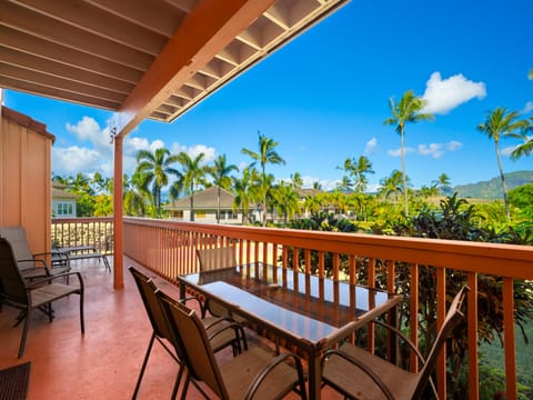 Your private balcony offers stunning tropical views with swaying palms and mountain vistas—perfect for morning coffee or sunset cocktails.