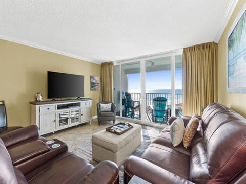 Sink into plush leather seating while enjoying breathtaking ocean views from your private balcony through floor-to-ceiling windows.