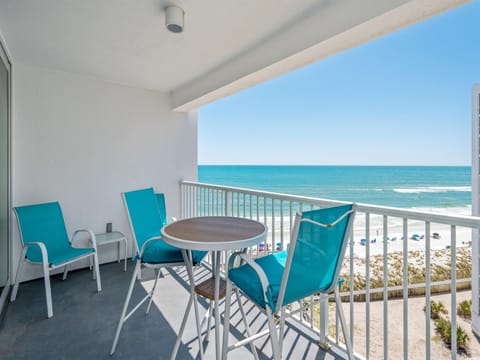 Sip your morning coffee on your private balcony while turquoise waves dance before pristine white sand.