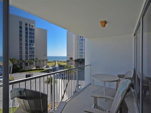 Relax on your private balcony with ocean glimpses between coastal towers, perfect for morning coffee or sunset cocktails.