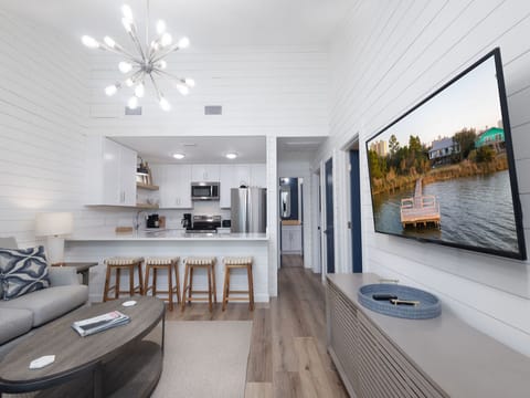This cozy duplex unit is setup to utilize every square inch of space. The open living area flows seamlessly into the kitchen with dining in between  at the open bar. The large mounted television offers entertainment during your down time.