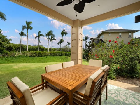Enjoy tropical dining at your covered lanai overlooking lush lawns and swaying palms in paradise.