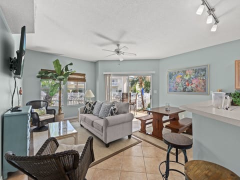 Sink into the plush sofa and enjoy your tropical oasis with calming décor, modern amenities, and peaceful balcony views.